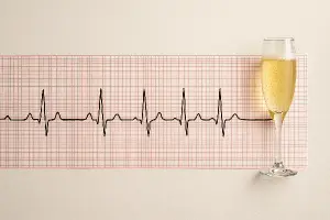 Reálná EKG křivka na jejímž konci bude sklenička prossecca.
