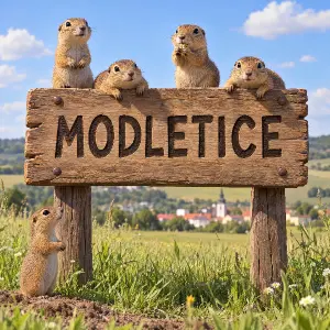 Na poli je 3D kreslená dřevěná cedule s nápisem MODLETICE, na ceduli je několik syslů